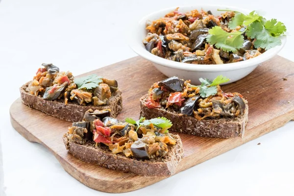 Sandwiches with eggplant caviar and coriander leaves — Stock Photo, Image
