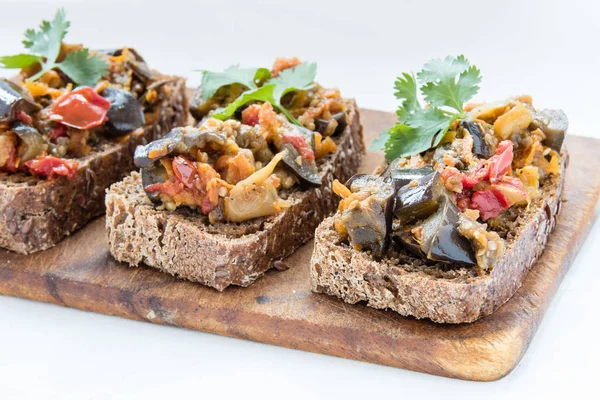 Sandwiches with eggplant caviar and coriander leaves — Stock Photo, Image