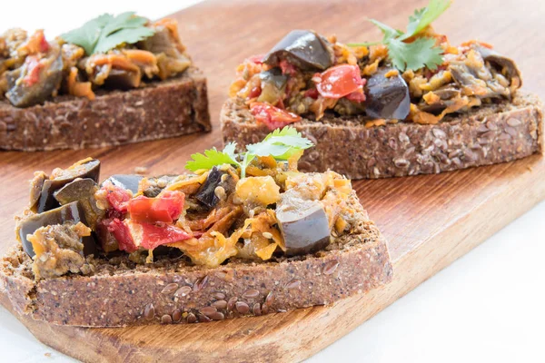 Sandwiches with eggplant caviar and coriander leaves — Stock Photo, Image