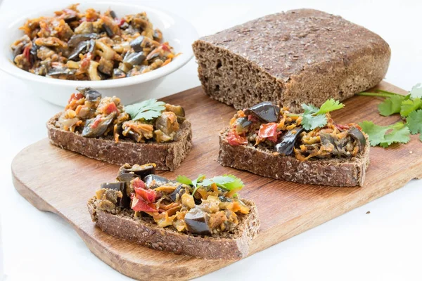 Sandwiches with eggplant caviar and coriander leaves — Stock Photo, Image