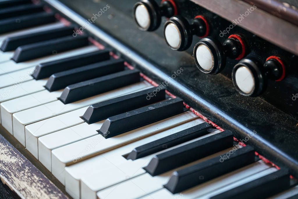 Piano keyboard background with selective focus. Piano, keyboard piano, side view of instrument musical tool.