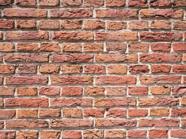 Eski tuğla duvar, kırmızı taş blokların eski dokusu.