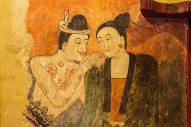 Nan, Tayland - 24 Kasım: Geleneksel Tay duvar boyama Wat Phumin Tapınağı duvara 24 Kasım 2013 tarihinde Nan, Tayland. Bir adamın bir kadına kulak fısıldayan ünlü duvar boyama.