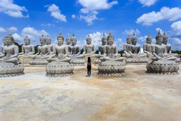 Thai people take a photo with Buddha statue and blue sky, Nakhon Si Thammarat Province, Thailan