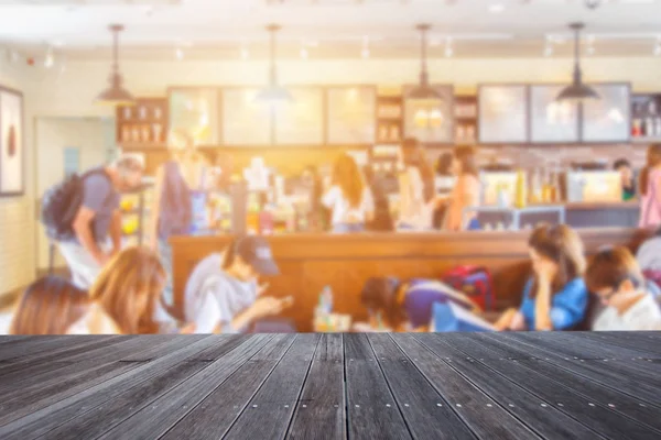 Tomma trä bord och suddig café med bokeh ljus bakgrund, produkt displayen montage — Stockfoto