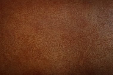 Dark brown leather texture closeup can be used as background. clipart