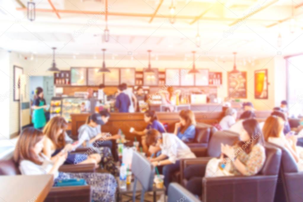 Blurred passenger in coffee shop. Abstract blur defocused background effect. Background for food and drink or relaxing in restaurant concept.