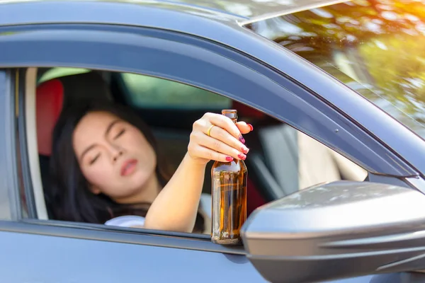Close Hand Female Holding Bottom Beer While Sleeping Car — ストック写真