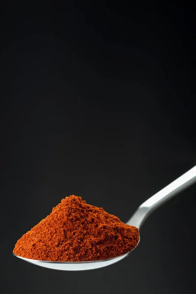 Spoon of powder red chili pepper — Stock Photo, Image