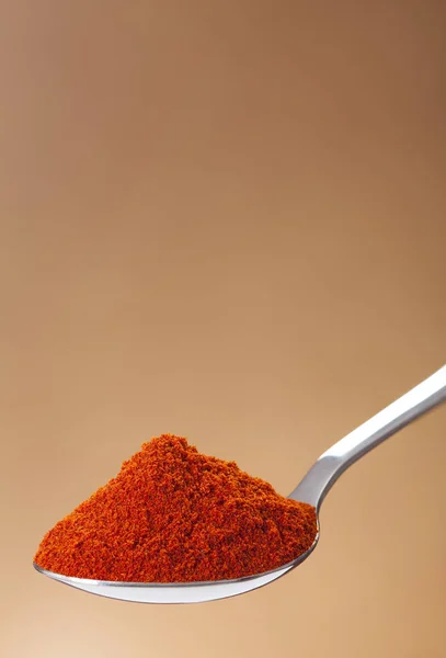 Spoon of powder red chili pepper — Stock Photo, Image