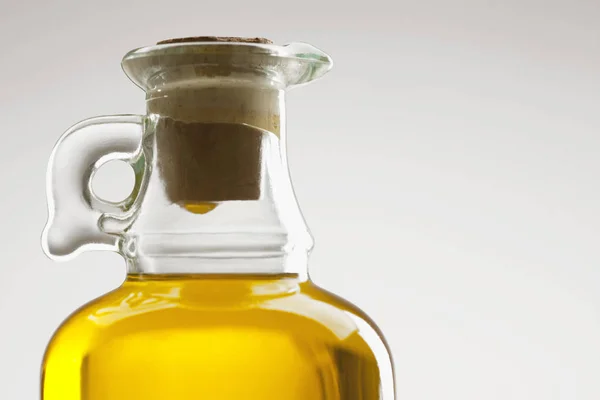 Glass bottle of oil — Stock Photo, Image