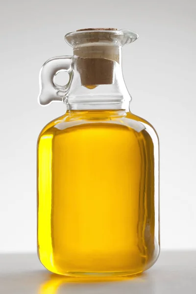Glass bottle of oil — Stock Photo, Image