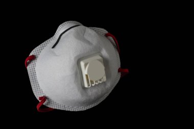 horizontal view on foreground of a safety mask ffp3 type isolated on black background clipart