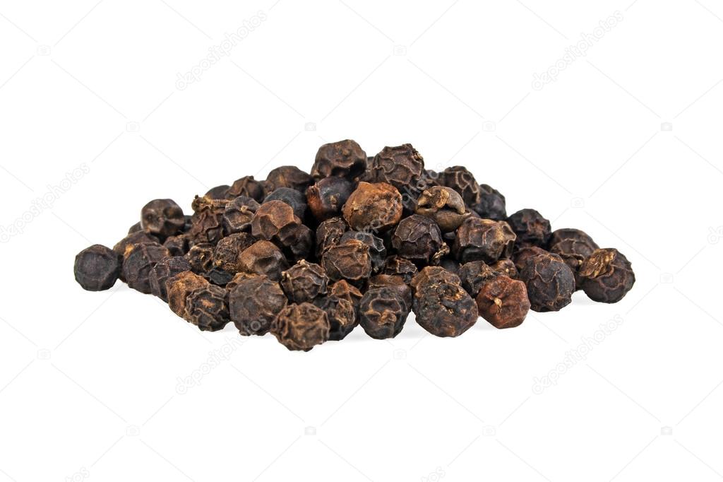 Close-up of peppercorns on white background