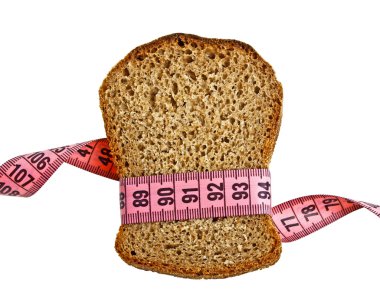 Diyet kavramı - izole bant ölçerek kavradı ekmek parçası