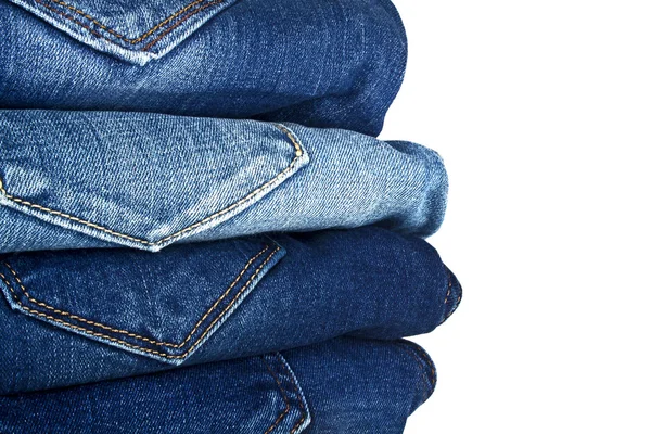 Massa olika Blå jeans isolerad på vit bakgrund — Stockfoto