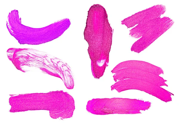 Zestaw w pociągnięcia szminka fioletowy kolor na białym tle — Zdjęcie stockowe