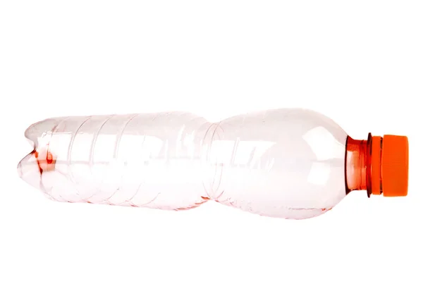 Použití červené plastová láhev na bílém pozadí — Stock fotografie