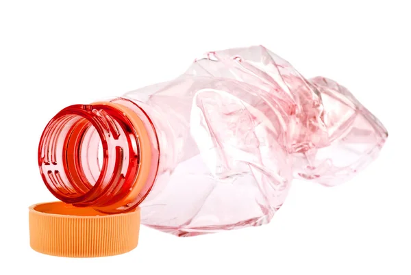 Použití červené plastová láhev na bílém pozadí — Stock fotografie