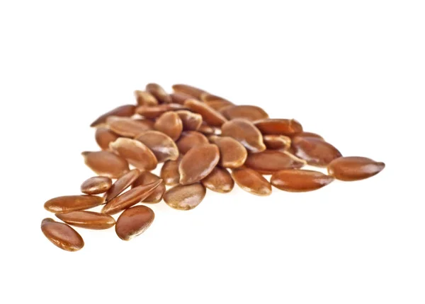 Close up de sementes de linho isoladas em fundo branco — Fotografia de Stock