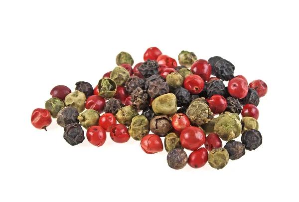 Heap of various pepper peppercorns seeds mix on white background — Stock Photo, Image