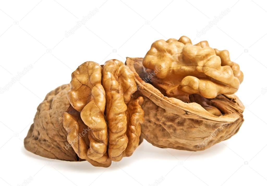 Walnut and a cracked walnut isolated on a white background