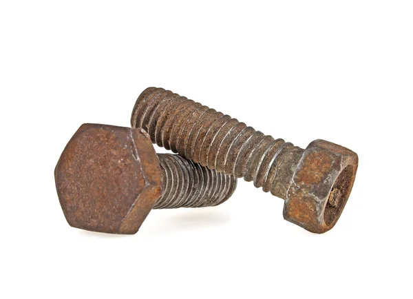 Old rusty iron bolts isolated on white background, selective foc — Stock Photo, Image