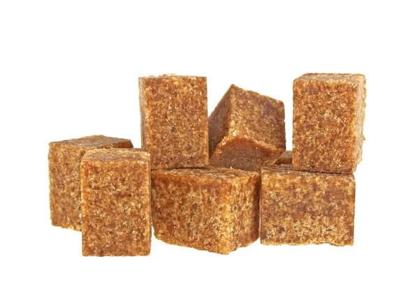 Brown sugar cubes on a white background — Stock Photo, Image