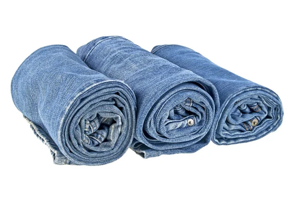 Un sacco di jeans diversi isolati su sfondo bianco — Foto Stock