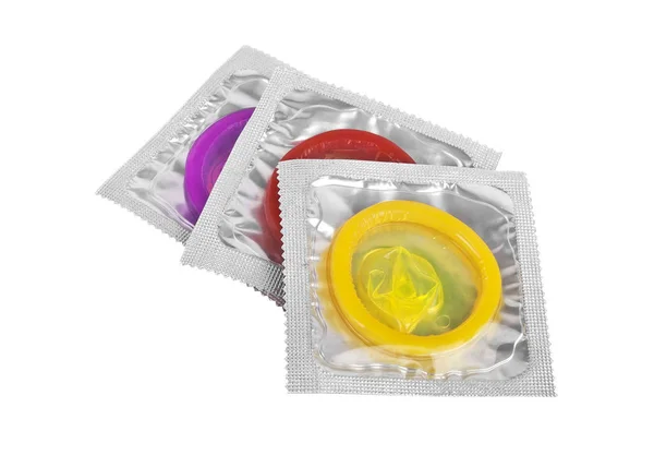 Close up of a colored condoms on white background — Stock Photo, Image