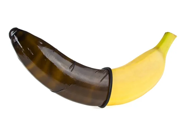 Condón negro y plátano aislados sobre fondo blanco. Sexo seguro c —  Fotos de Stock