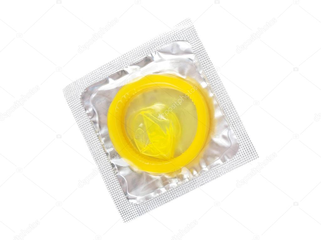 Close up of a yellow condom on white background