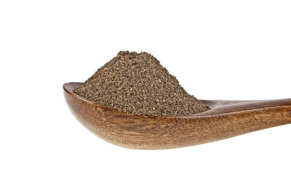 Black pepper in wooden spoon on a white background — Stock Photo, Image