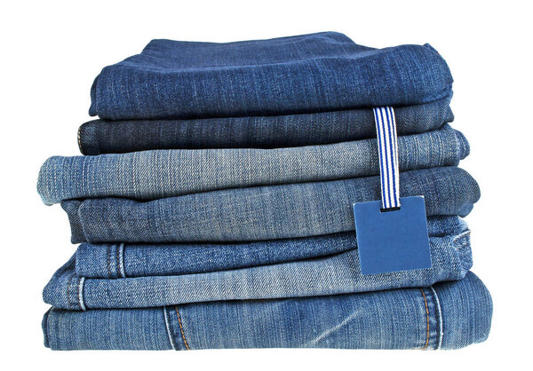 Lot of different blue jeans and label isolated on a white backgr