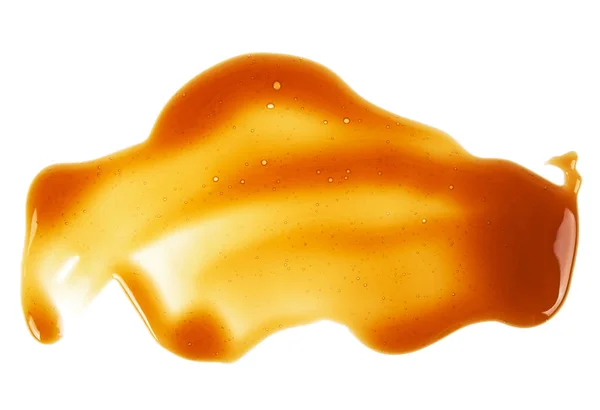Süße Karamellsoße isoliert auf weißem Hintergrund, Ansicht von oben — Stockfoto