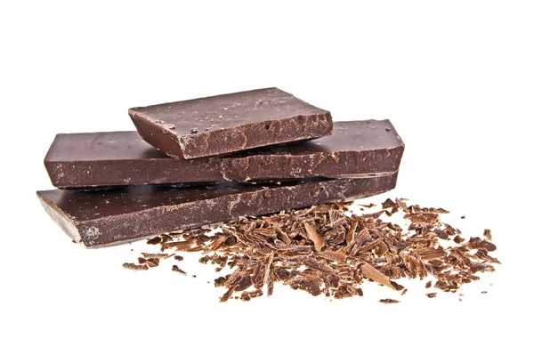 Montón de piezas rotas de chocolate sobre fondo blanco — Foto de Stock