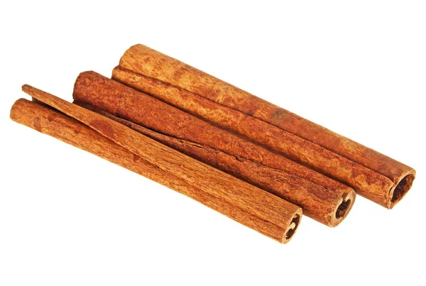 Three cinnamon sticks on a white background, close up — Stock Photo, Image