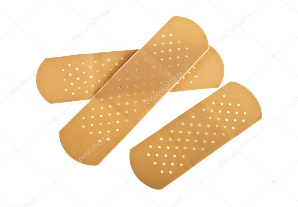 Medical adhesive plasters on a white background