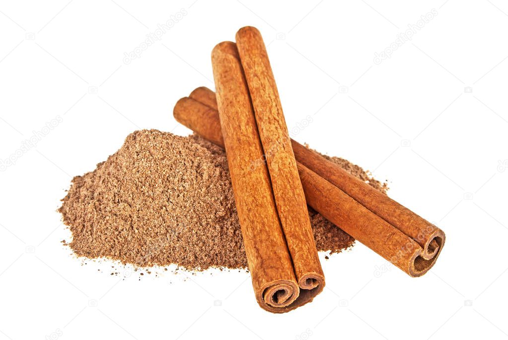 Cinnamon sticks and powder on white background