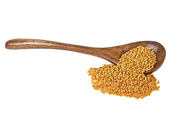 Mustard seeds in wooden spoon over white background — Stock Photo, Image