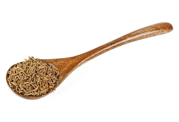 Semena kmínu v lžíci izolovaných na bílém pozadí — Stock fotografie