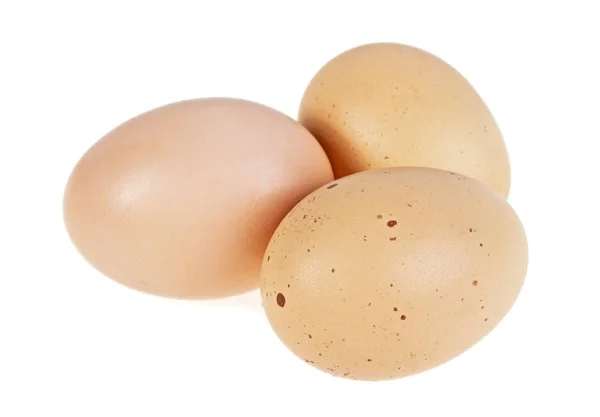 Three chicken eggs isolated on a white background — Stock Photo, Image