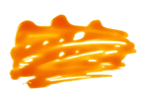 Flüssiges Karamell isoliert auf weißem Hintergrund — Stockfoto