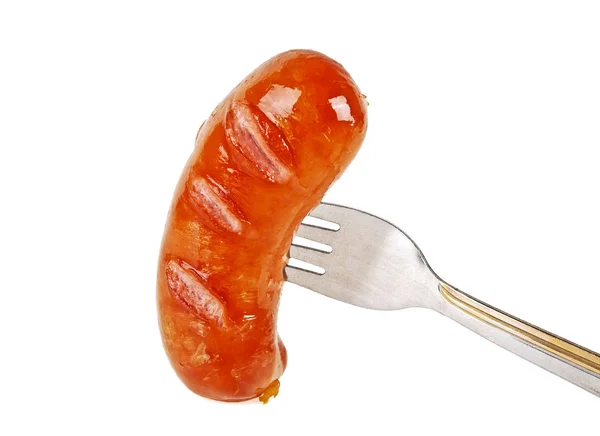 Salsicha e garfo isolado em um fundo branco, close-up — Fotografia de Stock