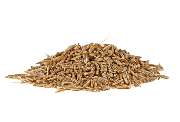 Close up de sementes de cominho no fundo branco — Fotografia de Stock