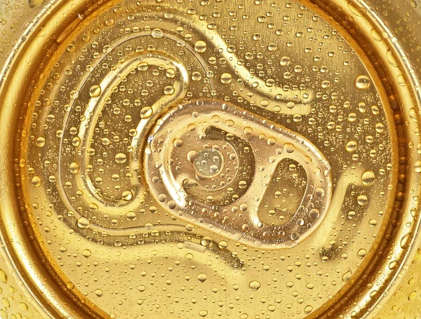 Can of beer in drops of water, as background