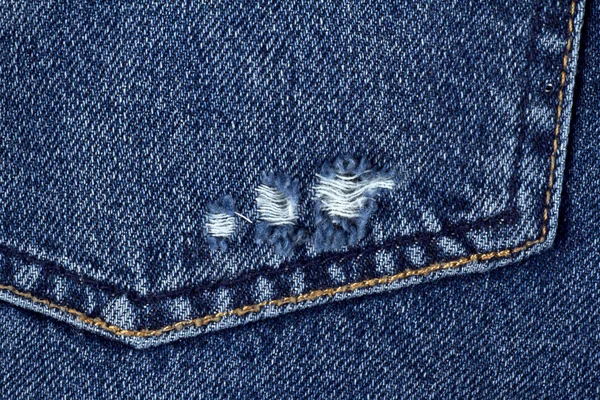 Textura de calça azul ou fundo de ganga com costura. Bolso de jeans — Fotografia de Stock