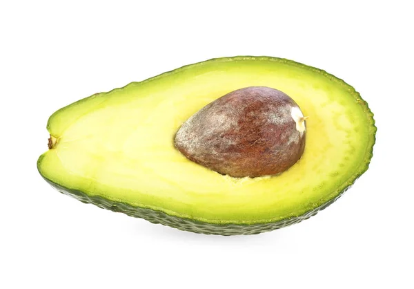 Половина авокадо з ядром на білому тлі — стокове фото