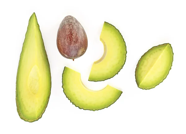 Набір шматочків авокадо ізольовано на білому тлі, вид зверху — стокове фото