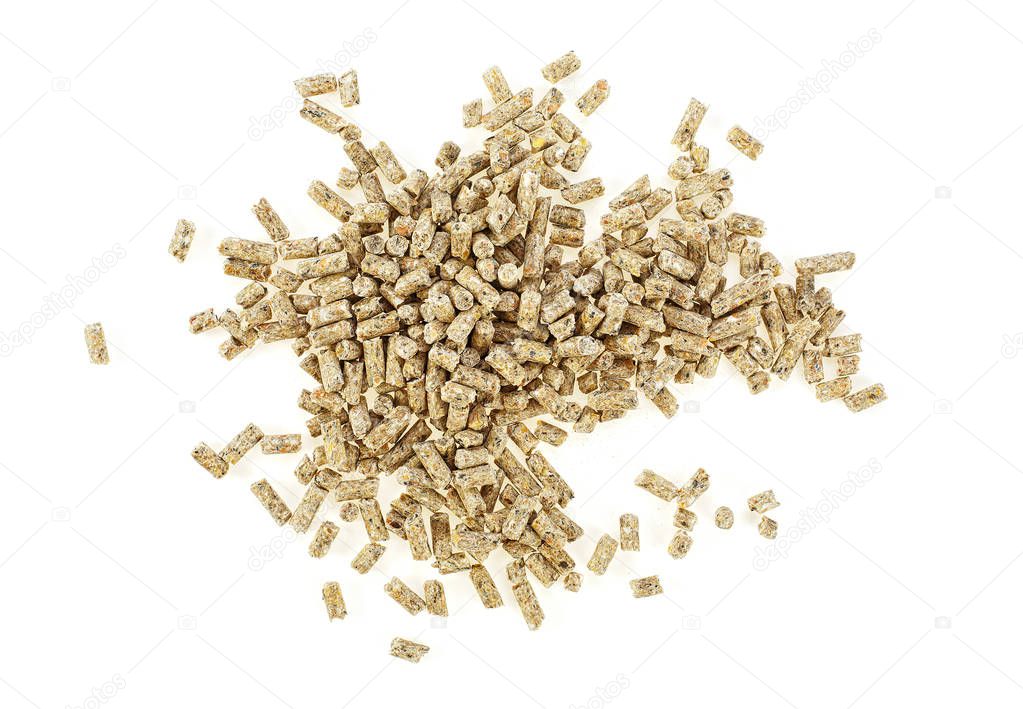 Pile of compound feed pellets isolated on a white background. To